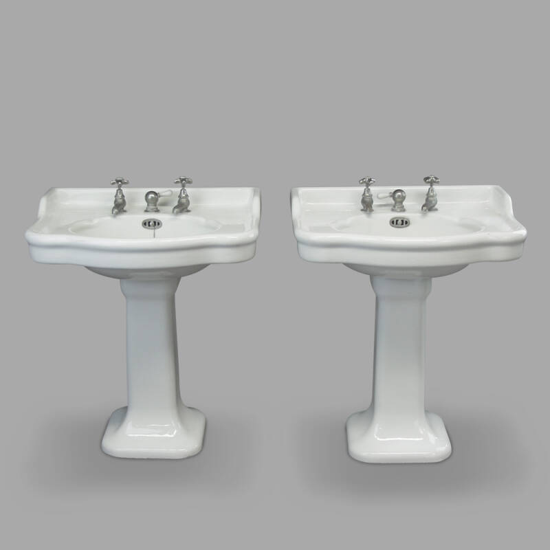 Two Enamelled Sinks on Pedestal